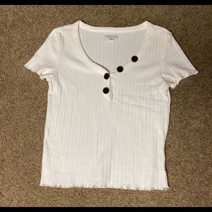 White top with brown buttons